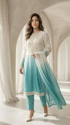 Woman wearing a white and blue traditional outfit in a bright room.