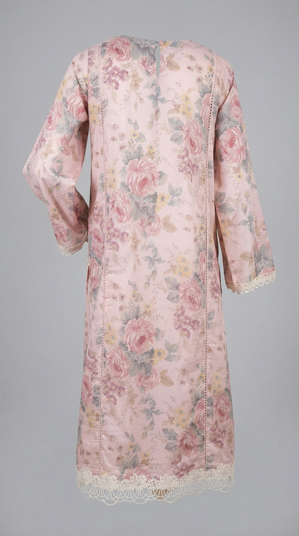 Floral patterned dress with lace details on a gray background