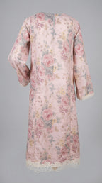 Floral patterned dress with lace details on a gray background