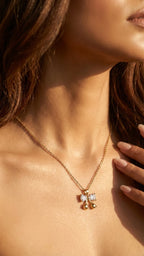 Dainty gold crystal bow necklace
Minimalist bow pendant with stones
Elegant ribbon charm necklace for women
Cute gold bow necklace closeup